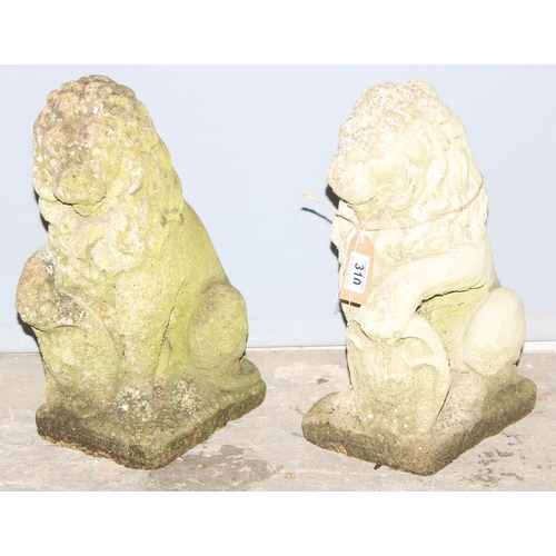 310 - A pair of weathered concrete garden lion statues, each approx 42cm tall