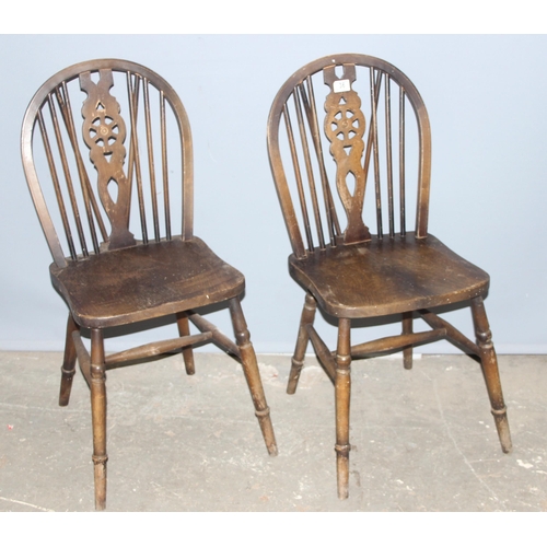 36 - A pair of vintage wheelback kitchen chairs