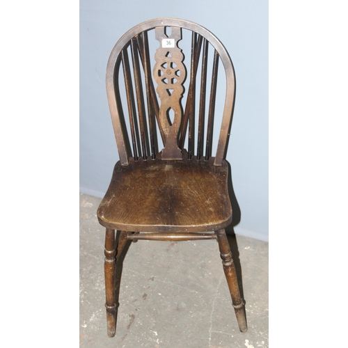 36 - A pair of vintage wheelback kitchen chairs