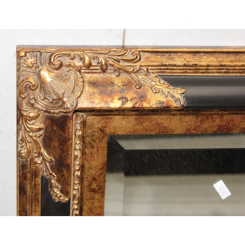 419 - Highly decorative gilt and black framed bevelled mirror approx. 45cm x 40cm