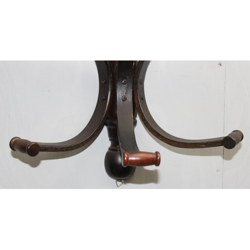 43 - A vintage bentwood wall mounted coat rack, approx 42cm wide