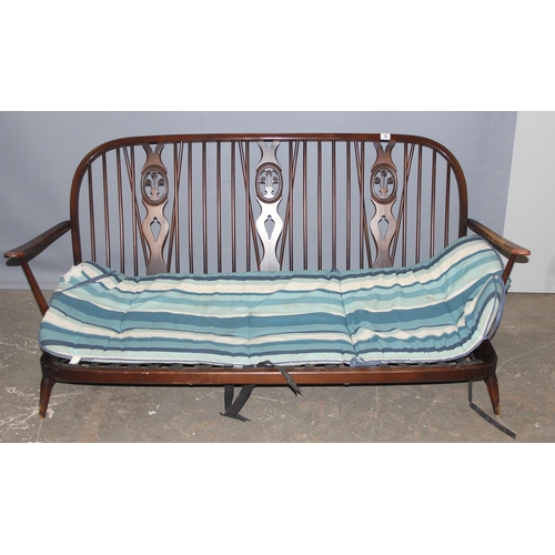 56 - A retro Ercol fleur-de-lys pattern 3 seater sofa frame, approx 176cm wide