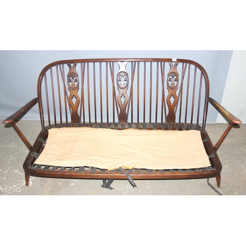 56 - A retro Ercol fleur-de-lys pattern 3 seater sofa frame, approx 176cm wide