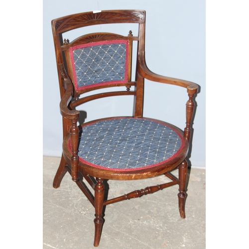 64 - An antique bedroom chair with blue upholstery