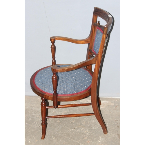 64 - An antique bedroom chair with blue upholstery