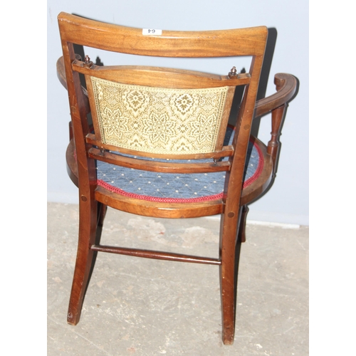 64 - An antique bedroom chair with blue upholstery