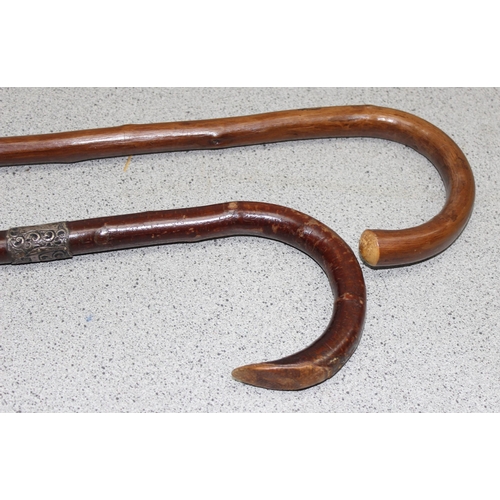 1621 - 2 bentwood walking sticks, 1 with silver collar