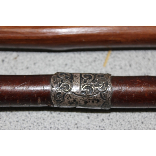 1621 - 2 bentwood walking sticks, 1 with silver collar