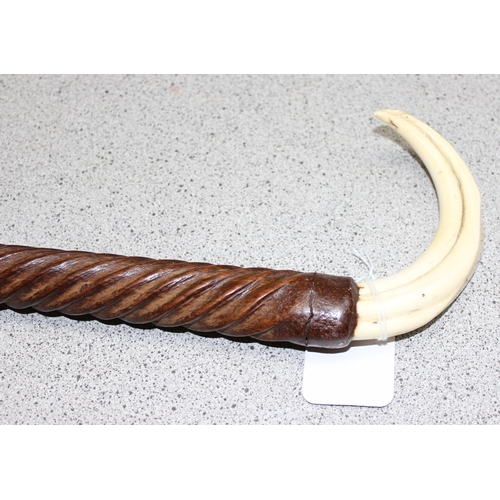 1627 - Carved wooden walking cane with Warthog tooth handle