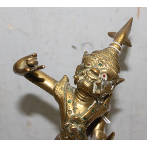 1630 - S.E Asian brass deity, stands approx. 24cm