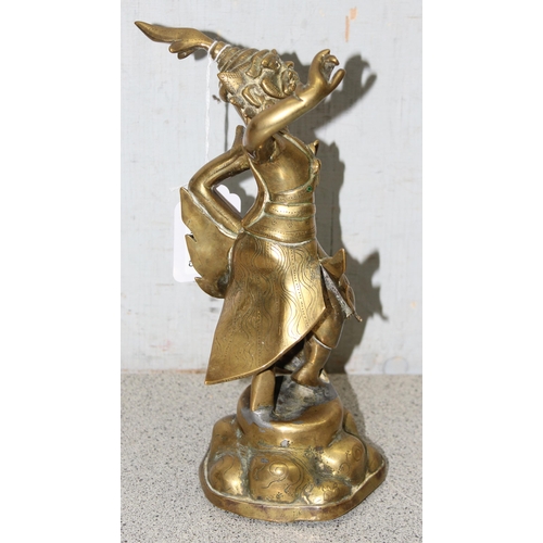 1630 - S.E Asian brass deity, stands approx. 24cm