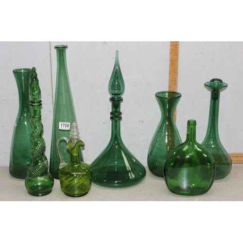 1708 - 8 assorted vintage green glass decanters, carafes, bottles etc