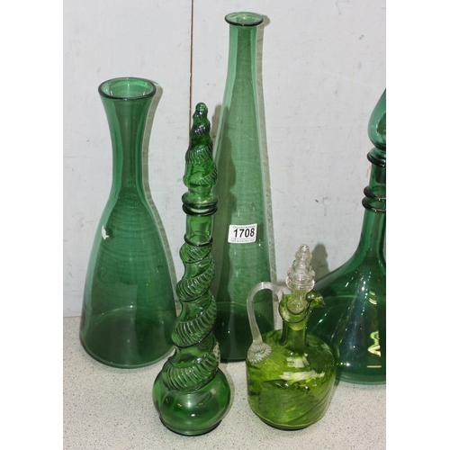 1708 - 8 assorted vintage green glass decanters, carafes, bottles etc