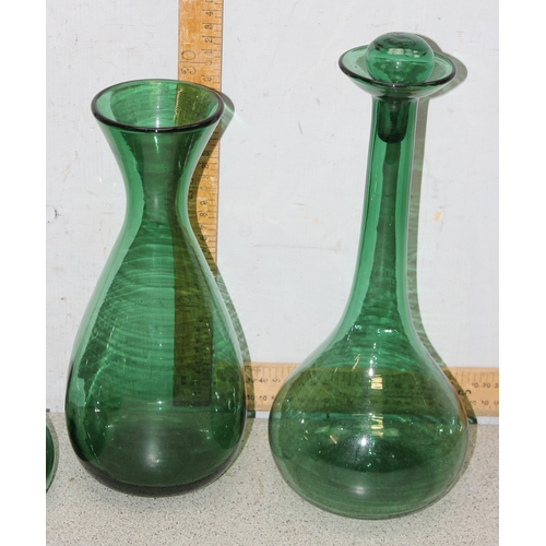 1708 - 8 assorted vintage green glass decanters, carafes, bottles etc