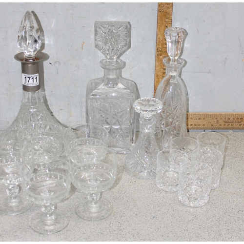 1711 - A large qty of assorted crystal and cut glass to include whisky tumblers and decanters etc