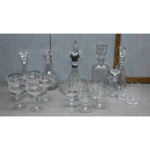 1711 - A large qty of assorted crystal and cut glass to include whisky tumblers and decanters etc