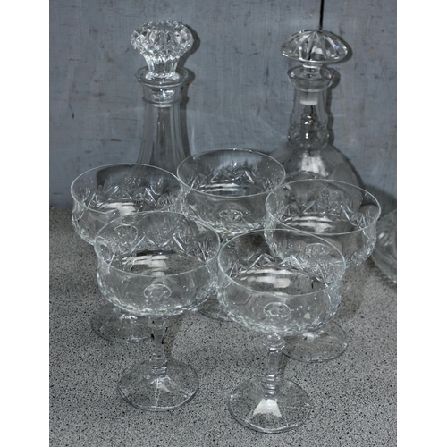 1711 - A large qty of assorted crystal and cut glass to include whisky tumblers and decanters etc