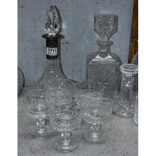 1711 - A large qty of assorted crystal and cut glass to include whisky tumblers and decanters etc