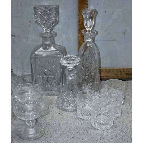 1711 - A large qty of assorted crystal and cut glass to include whisky tumblers and decanters etc