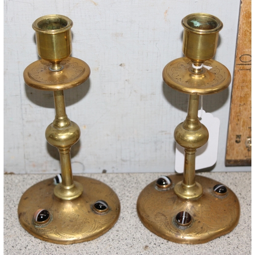 1716 - Pair of Arts and Crafts brass candlesticks with inlayed cabochon stones to base