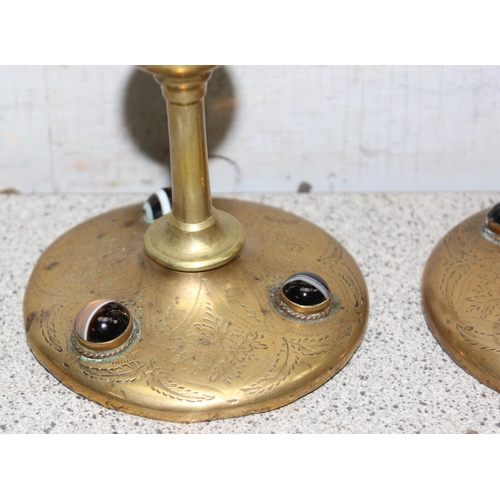 1716 - Pair of Arts and Crafts brass candlesticks with inlayed cabochon stones to base