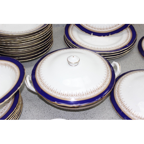 1723 - Large Royal Worcester 'Regency' dinner service with cobalt blue & gold gilt decoration