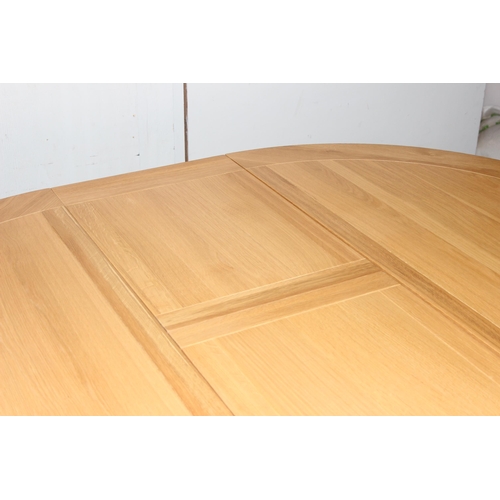 144 - Modern light oak extending dining table, approx size when extended 160cm x 120cm x 79cm