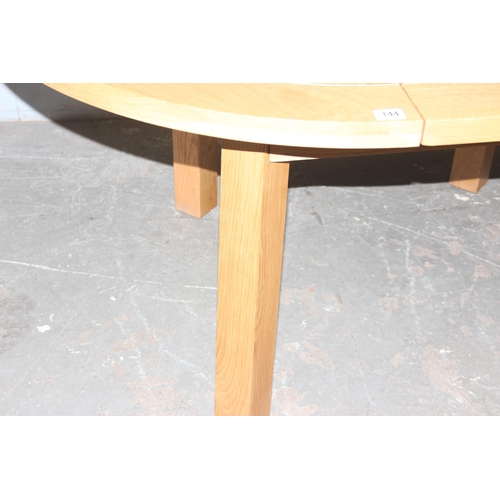 144 - Modern light oak extending dining table, approx size when extended 160cm x 120cm x 79cm