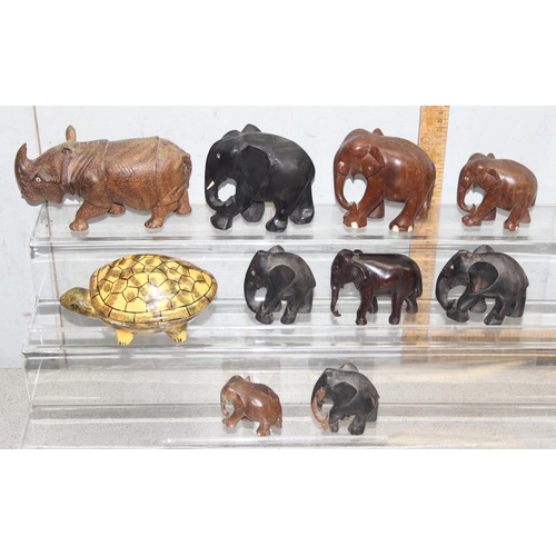 1807 - 10 assorted wooden and other animal figures to inc 8 Elephants, a wooden Rhino and a Papier Mache to... 