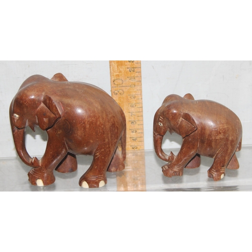 1807 - 10 assorted wooden and other animal figures to inc 8 Elephants, a wooden Rhino and a Papier Mache to... 