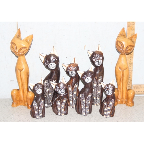 1822 - 9 standing wooden cat figures