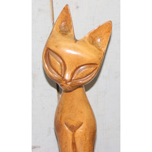 1822 - 9 standing wooden cat figures