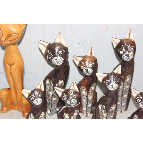 1822 - 9 standing wooden cat figures