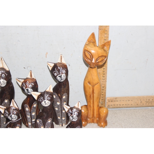 1822 - 9 standing wooden cat figures