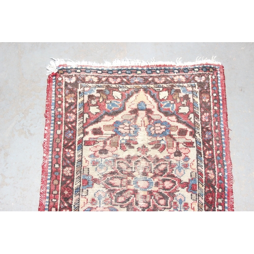 220 - 2 vintage rugs both of red ground, the largest approx 84cm x 56cm