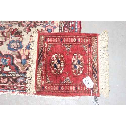 220 - 2 vintage rugs both of red ground, the largest approx 84cm x 56cm