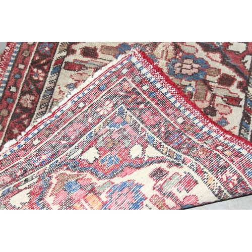 220 - 2 vintage rugs both of red ground, the largest approx 84cm x 56cm