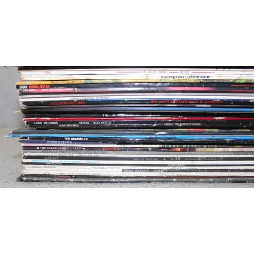 634 - Qty. of vinyl LP's & 12 inch singles to include AC / DC, Kiss & Sid Vicious