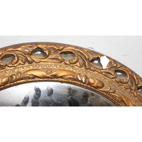 494 - A round antique style gilt plaster convex mirror, approx 50cm in diameter and a vintage Italian oil ... 