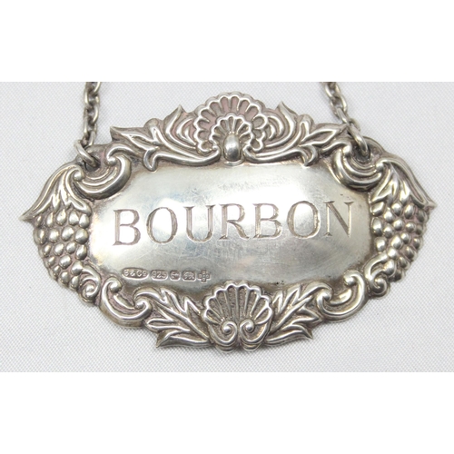 1088 - A highly decorative silver decanter label for Bourbon, Birmingham 2000 by Broadway & Co, approx 60mm... 