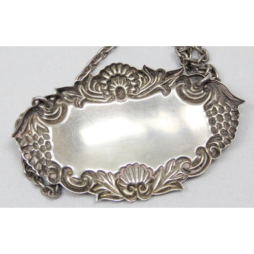 1088 - A highly decorative silver decanter label for Bourbon, Birmingham 2000 by Broadway & Co, approx 60mm... 