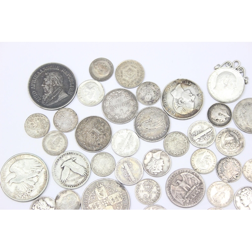 1241 - Qty of assorted mixed World and British silver coins to include an 1865 Gothic Florin, a 1942 Walkin... 