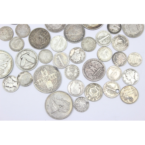 1241 - Qty of assorted mixed World and British silver coins to include an 1865 Gothic Florin, a 1942 Walkin... 