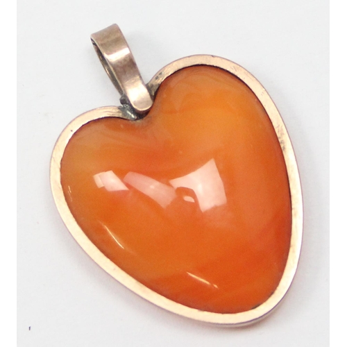 2394 - A 9ct gold and polished stone heart pendant, unmarked but XRF confirmed, and a 9ct gold front and ba... 