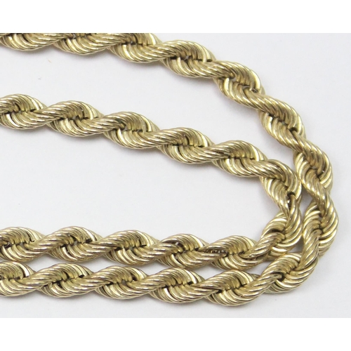 2399 - A long 9ct gold rope twist necklace and similar matching bracelet, both marked and XRF confirmed, th... 