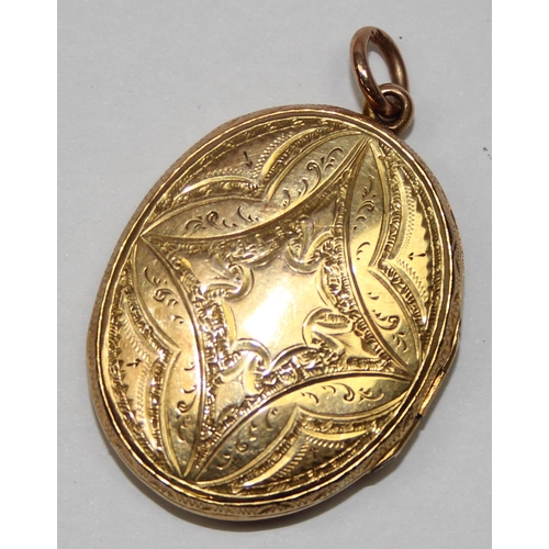 2410 - An antique gold locket with highly detailed engraved decoration, likely 19th century, seemingly unma... 