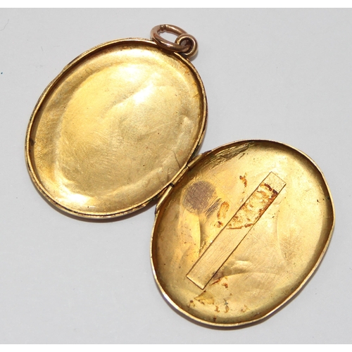 2410 - An antique gold locket with highly detailed engraved decoration, likely 19th century, seemingly unma... 