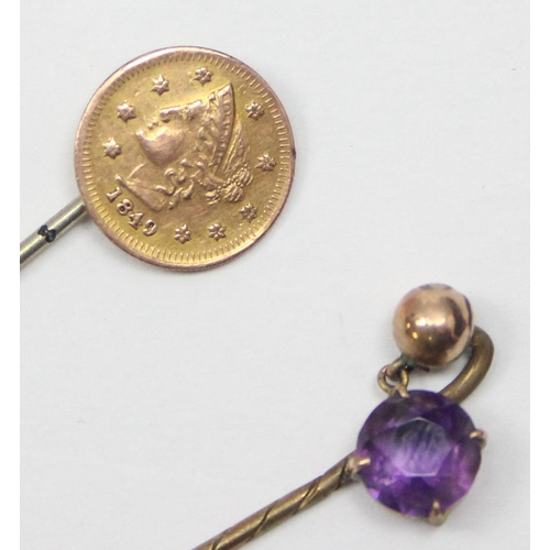 2438 - 2 vintage 9ct gold mounted stick pins, one with amethyst drop and the other formed as a US coin, bot... 