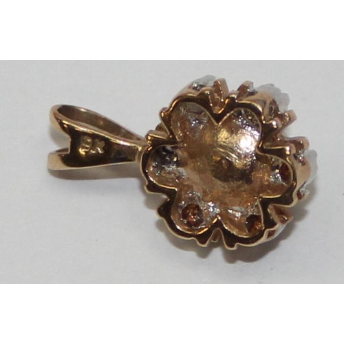 2440 - A 9ct gold pendant mounted with a small pearl surrounded by diamonds, marked 9k and XRF confirmed, a... 