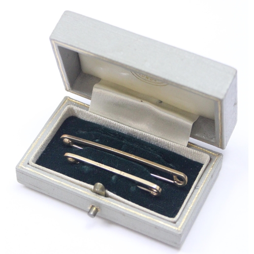 2442 - A pair of 9ct gold gentleman's tie pins in original box by Tessiers of Bond St, each engraved W.W.D ... 